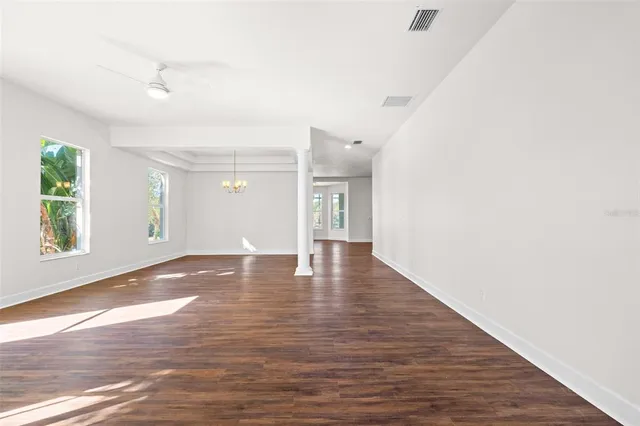 a kitchen with white cabinets stainless steel appliances and sink