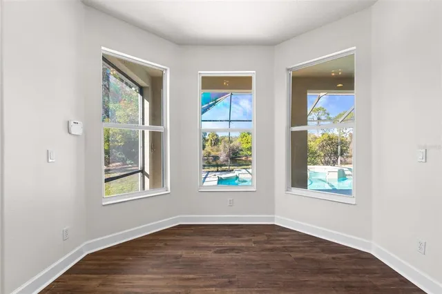 a bathroom with a toilet a sink a mirror and vanity