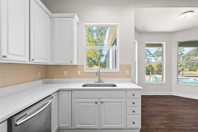 a room with a sink and cabinets