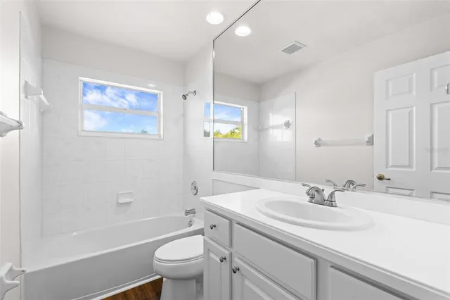 an aerial view of houses with yard