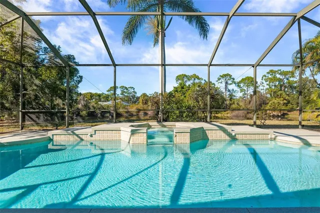 a view of a swimming pool with a patio