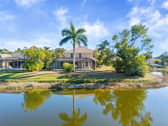a house with swimming pool in front of it