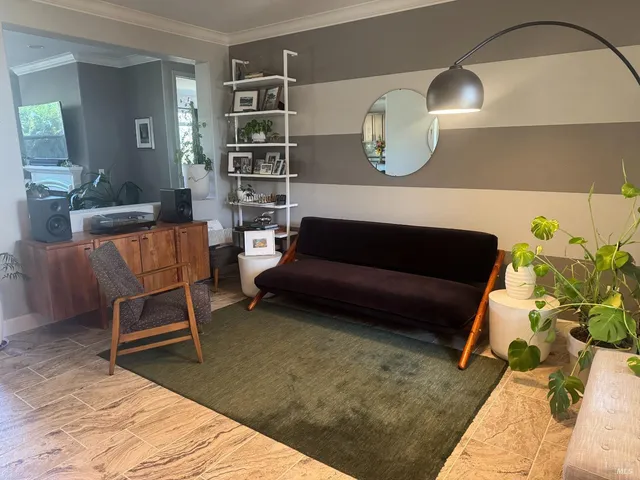 a living room with furniture and a rug