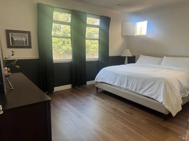 a bedroom with a bed and window