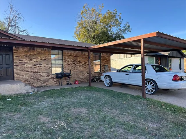 a view of a cars in front of a house
