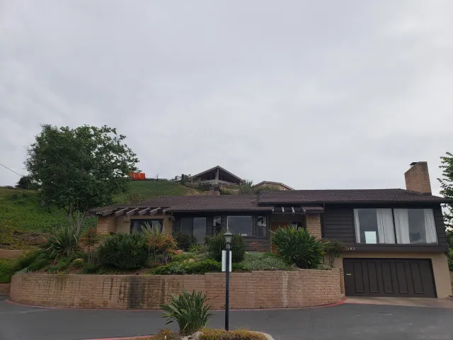 a front view of a house with garden