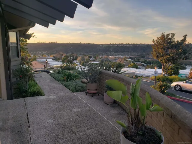 a view of room with window and wooden floor