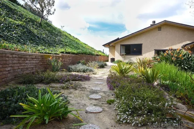 a view of a pathway with a yard