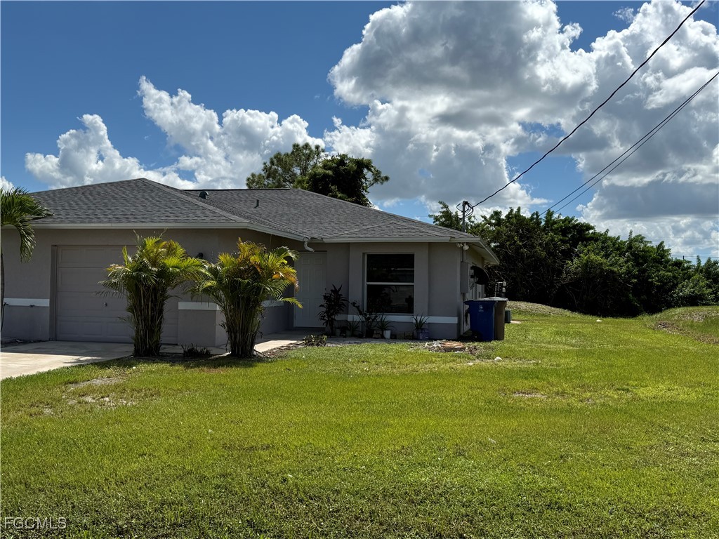 a view of a house with backyard porch and garden