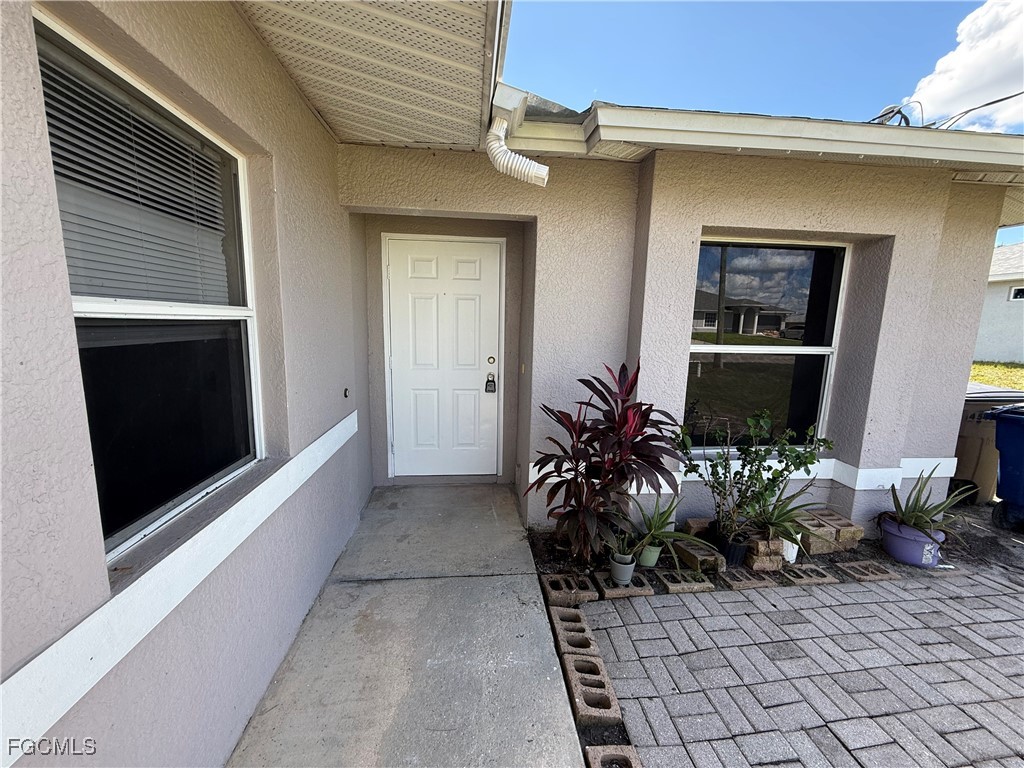 4547 21st Street Southwest Lehigh Acres, FL 33973 - Photo 2 of 12 a living room with furniture