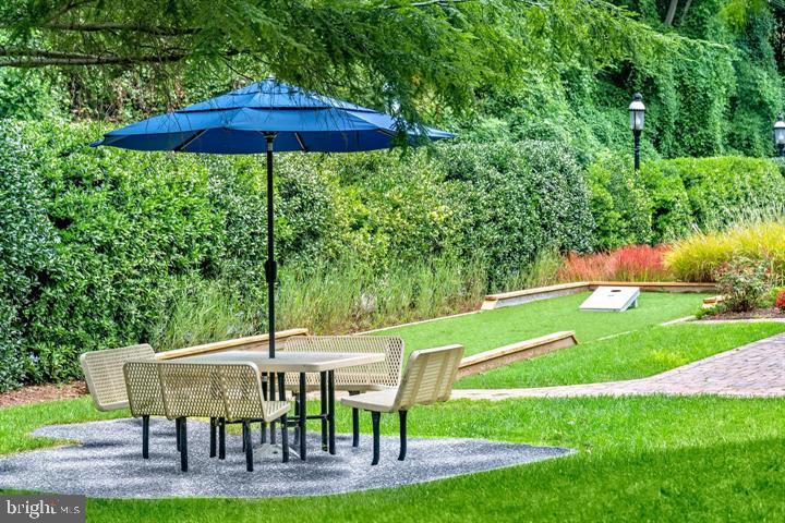 6005 Hunt Ridge Road, Unit 3411 Baltimore, MD 21210 - Photo 14 of 19 a view of an chairs and backyard