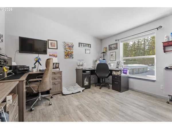 a workspace with furniture hardwood and a window