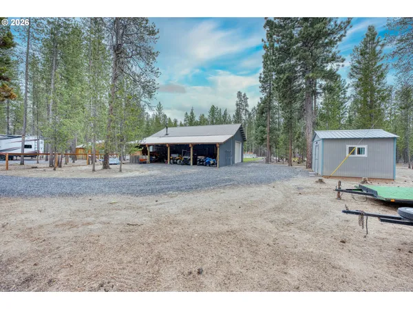 a view of a outdoor space with a house in the background