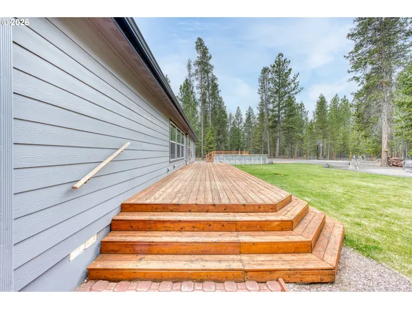 a view of backyard with swimming pool