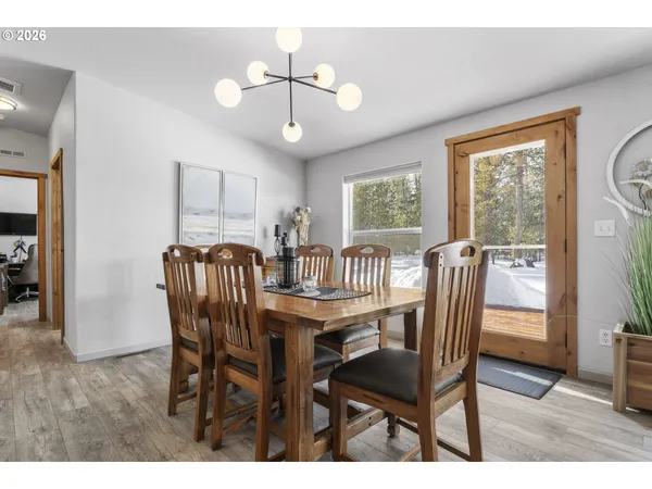 a view of a dining room with furniture window and outside view
