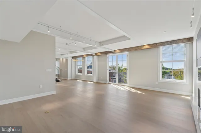a view of a balcony with wooden floor