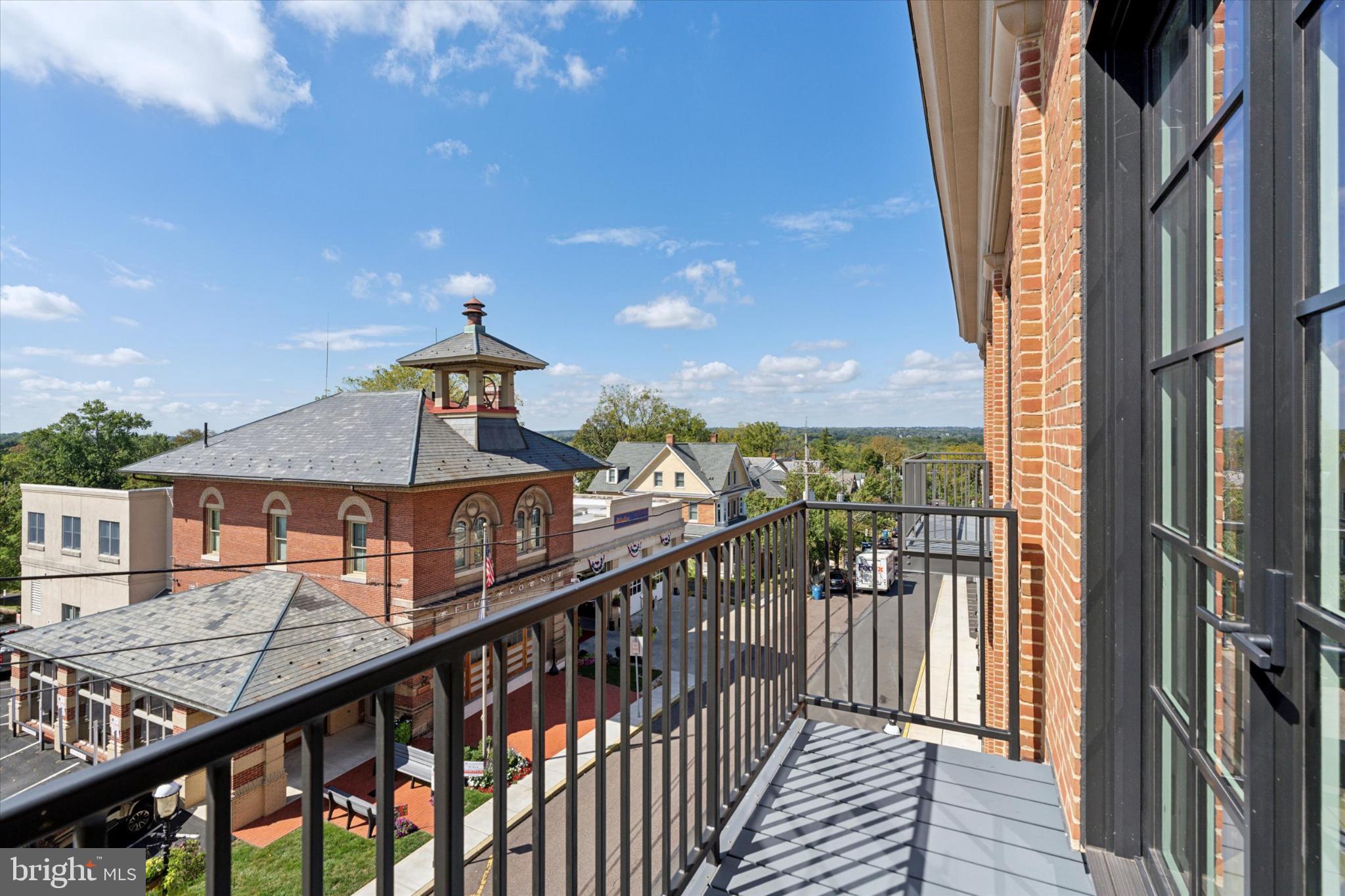 50 North Main Street, Unit 302 Doylestown, PA 18901 - Photo 13 of 33 a view of a balcony with wooden floor