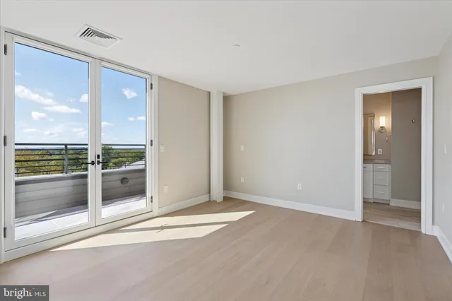a bathroom with a shower tub double vanity and a glass door shower