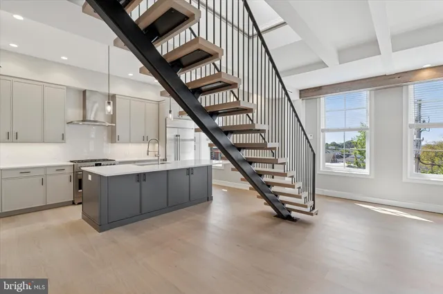a kitchen with a refrigerator and a sink