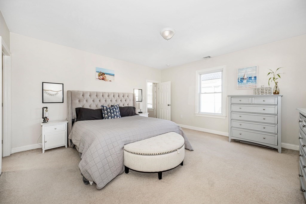 15 Vine Street Medford, MA 02155 - Photo 12 of 23 a bedroom with a bed and closet