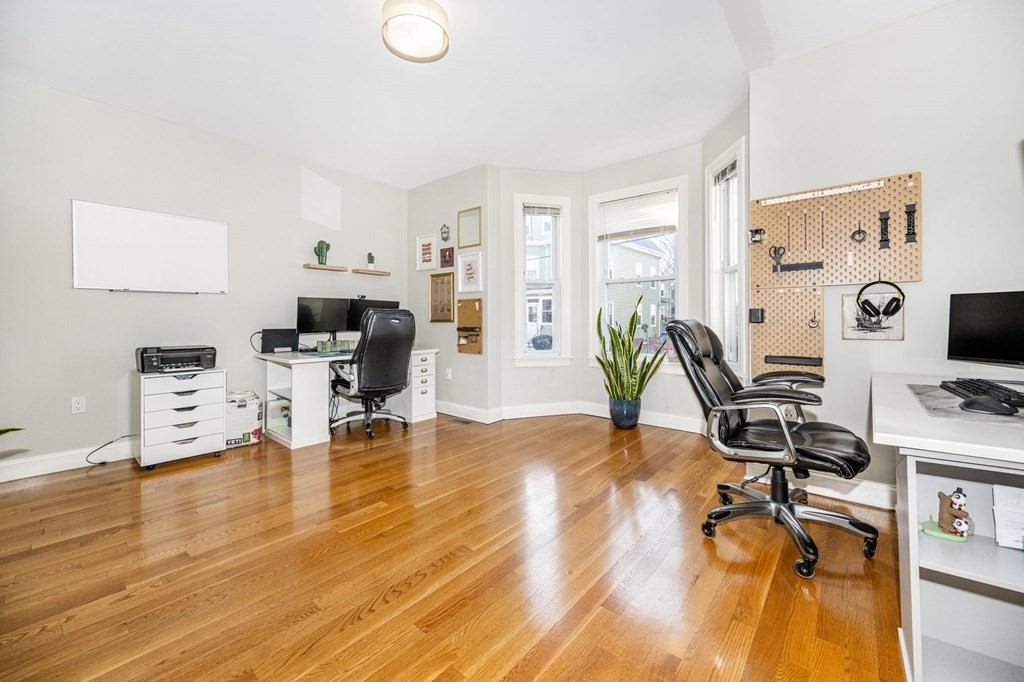 15 Vine Street Medford, MA 02155 - Photo 18 of 23 a workspace with furniture and wooden floor