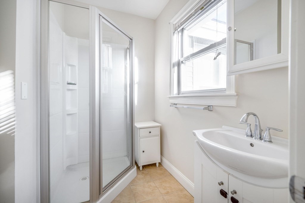 15 Vine Street Medford, MA 02155 - Photo 19 of 23 a bathroom with a sink and a bathtub