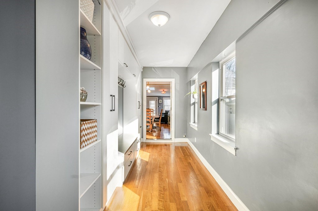 15 Vine Street Medford, MA 02155 - Photo 2 of 23 a view of a hallway with wooden floor and cabinet