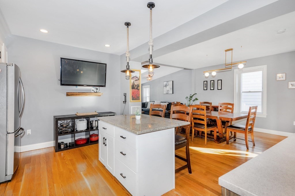 15 Vine Street Medford, MA 02155 - Photo 3 of 23 a large kitchen with a table and chairs