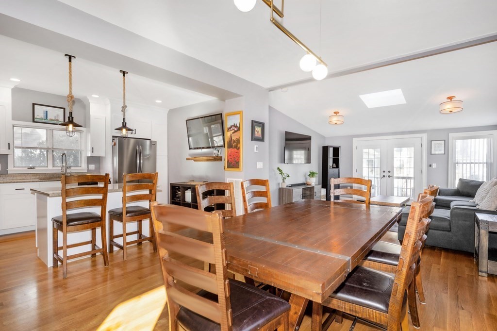 15 Vine Street Medford, MA 02155 - Photo 6 of 23 a living room with fireplace furniture and a wooden floor