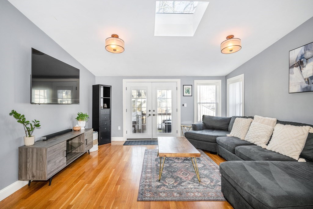 15 Vine Street Medford, MA 02155 - Photo 7 of 23 a living room with furniture and a flat screen tv