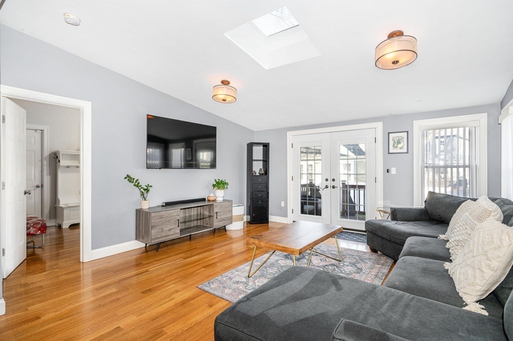 15 Vine Street Medford, MA 02155 - Photo 9 of 23 a living room with furniture and a flat screen tv