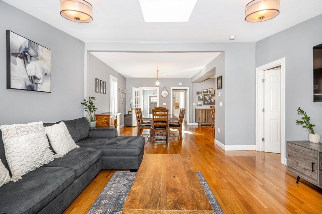 15 Vine Street Medford, MA 02155 - Photo 10 of 23 a living room with furniture and a wooden floor