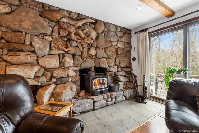 a living room with a couch and a window