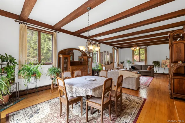 a view of a dining room with furniture window and outside view
