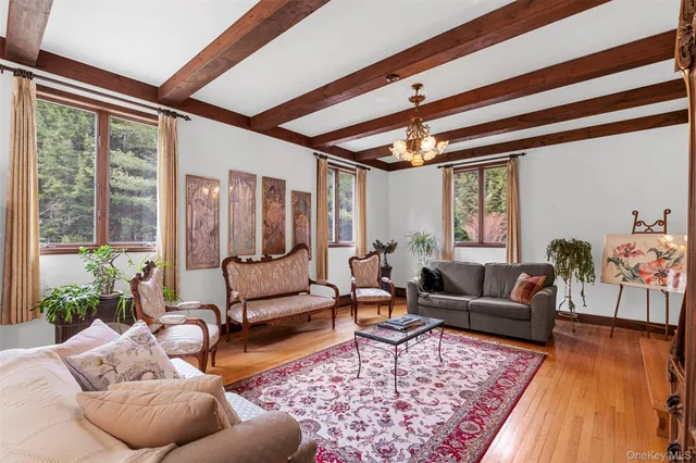 a living room with furniture or couch and a large window