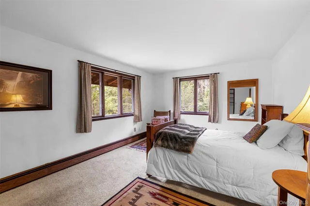 a spacious bathroom with a double vanity sink and a mirror