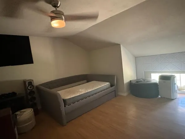 a room with furniture and air hockey table