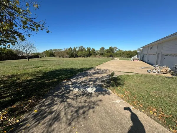 a view of a lake with houses in background