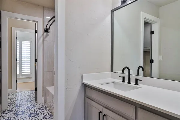a bathroom with a sink and a mirror