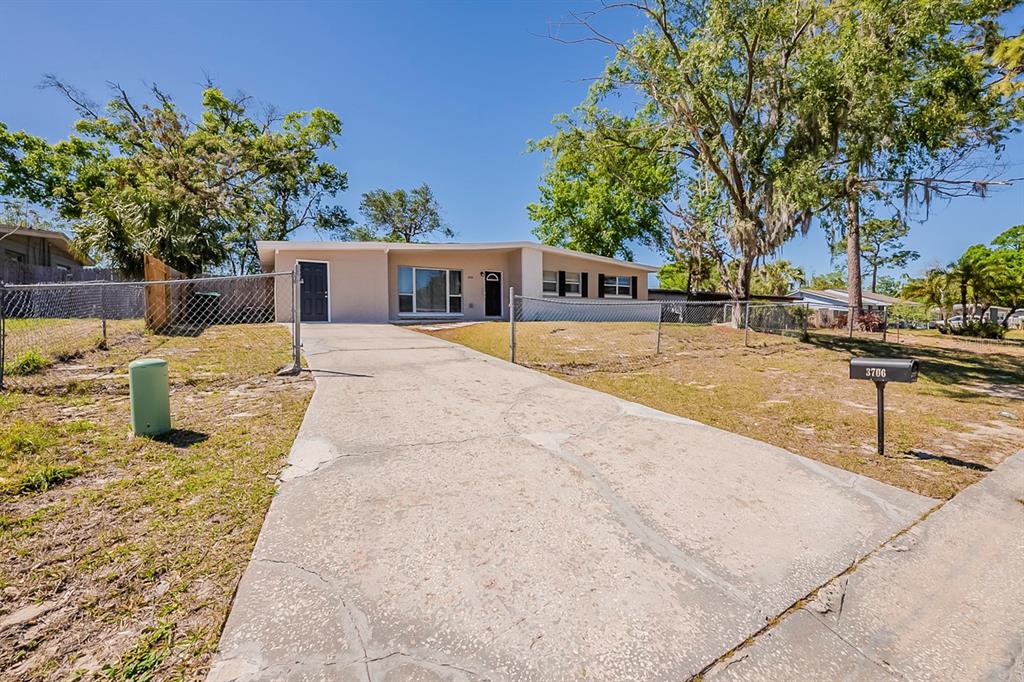 3706 Wade Road Orlando, FL 32808 - Photo 1 of 1 a view of a house with a patio