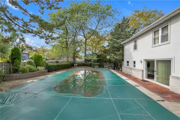 a view of a swimming pool with a patio