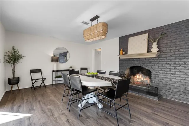 a view of a livingroom with furniture and a fireplace