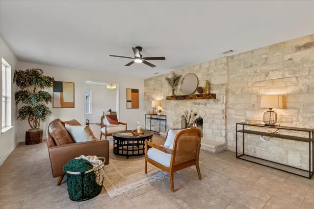 a living room with furniture gym equipment and a fireplace