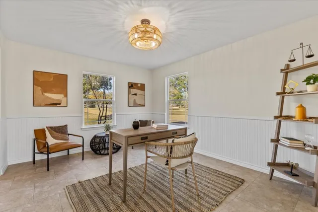 a workspace with furniture and window