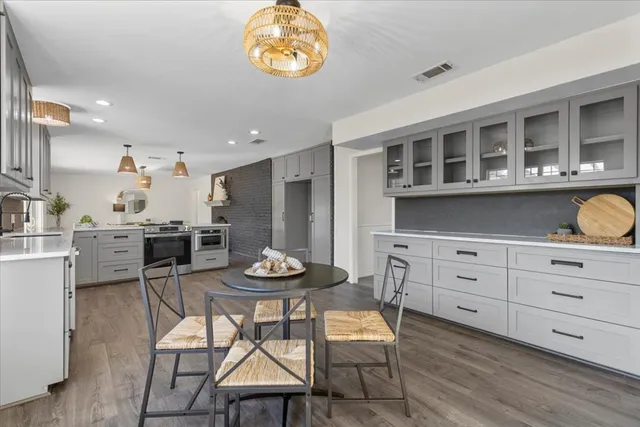 a kitchen with a stove and cabinets