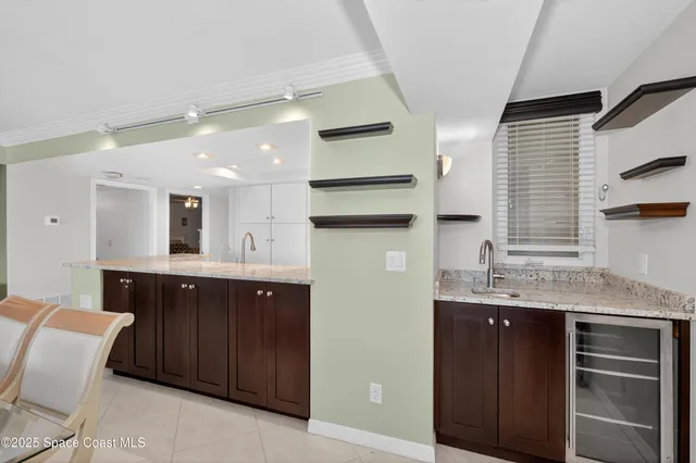 a living room with furniture tv and a window