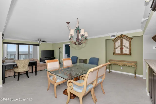 a bathroom with cabinets and mirror