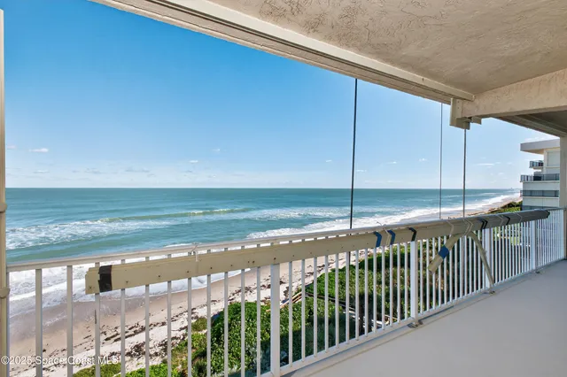 a bed room with a bed and a large window