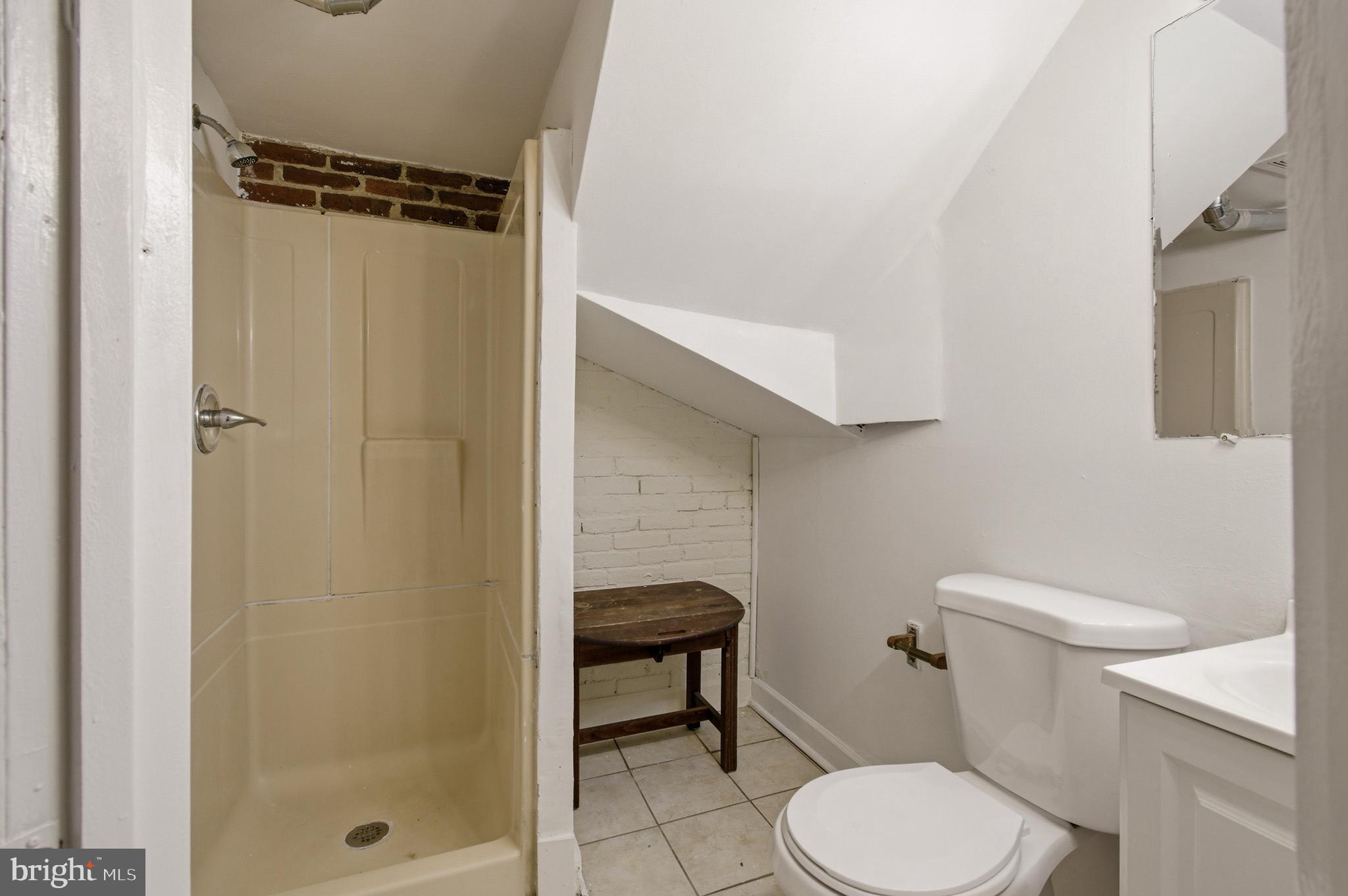 1616 Good Hope Road Southeast Washington, DC 20020 - Photo 16 of 25 a bathroom with a toilet and a shower