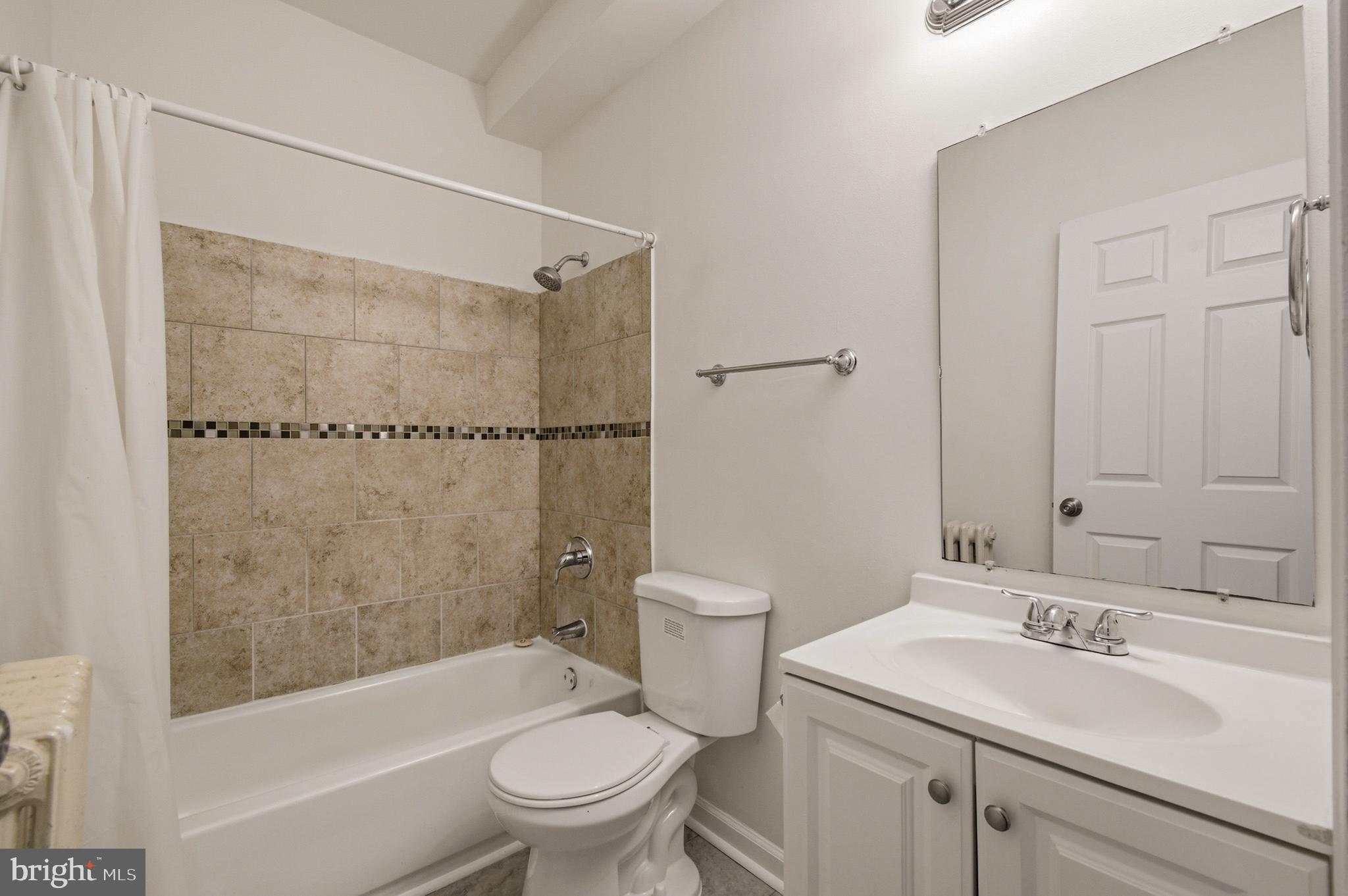 1616 Good Hope Road Southeast Washington, DC 20020 - Photo 18 of 25 a bathroom with a sink toilet and shower